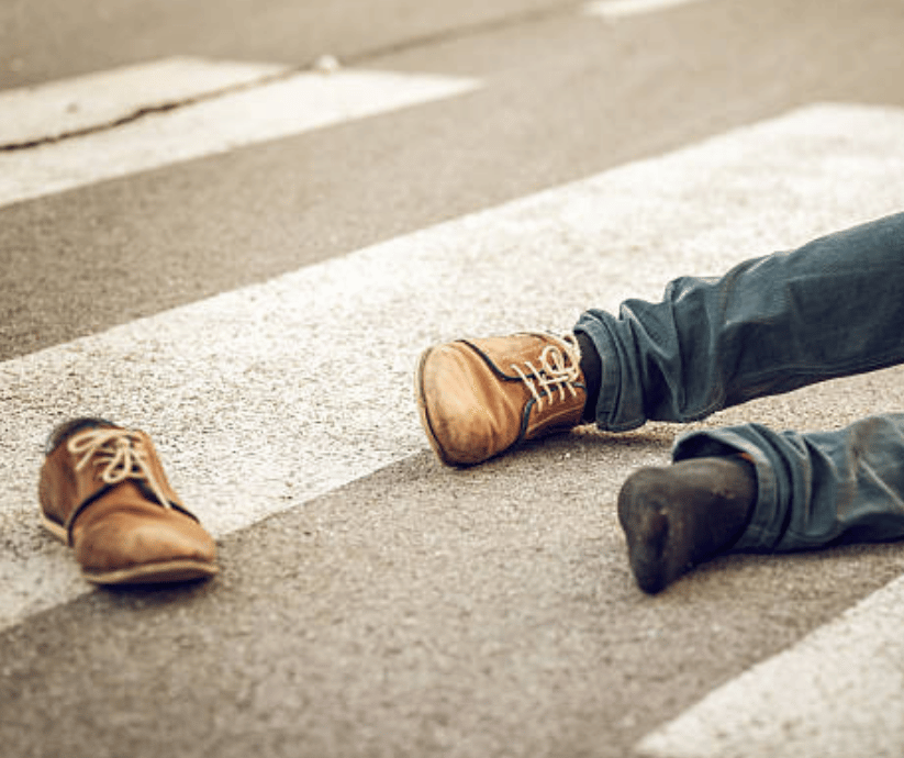Crosswalk scene with traffic nearby.